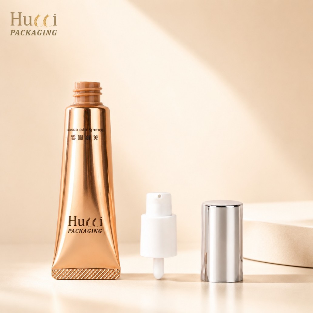 Finished metallic copper ABL eye cream squeeze tube with pump and silver aluminum outer lid}