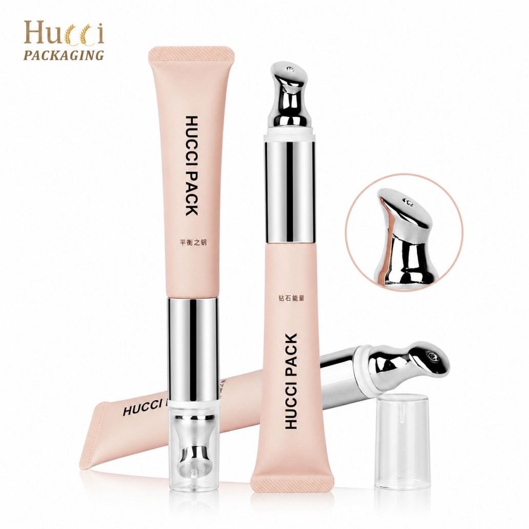Matte pink PE cosmetic tube with human induction vibrating metal massage tip eye lip skincare tube white background
