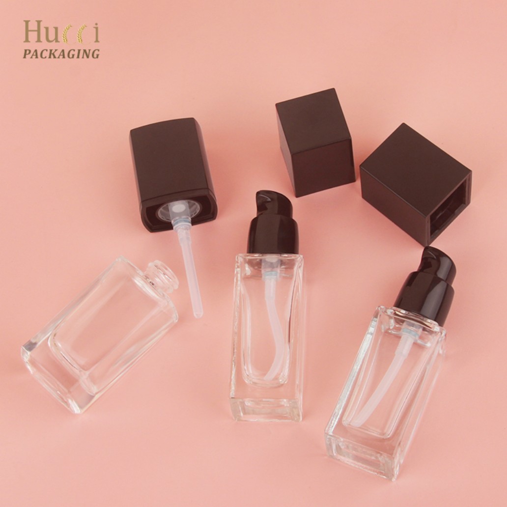 HUCCI 30ml Square Glass Pump Bottles Disassembled Flat Lay Pink Background}