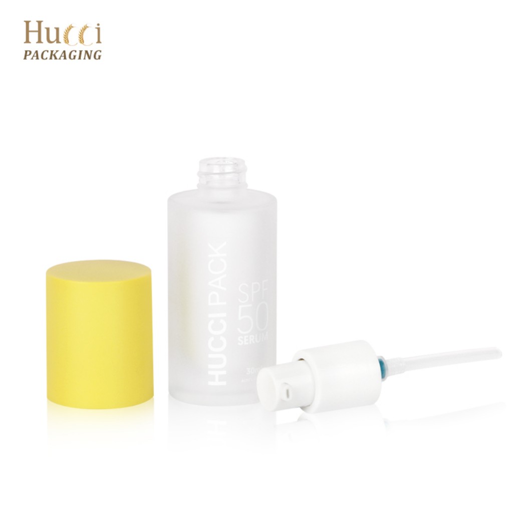 HUCCI 30ml Frosted Glass Lotion Pump Bottle Separated Yellow Cap and Pump White Background}