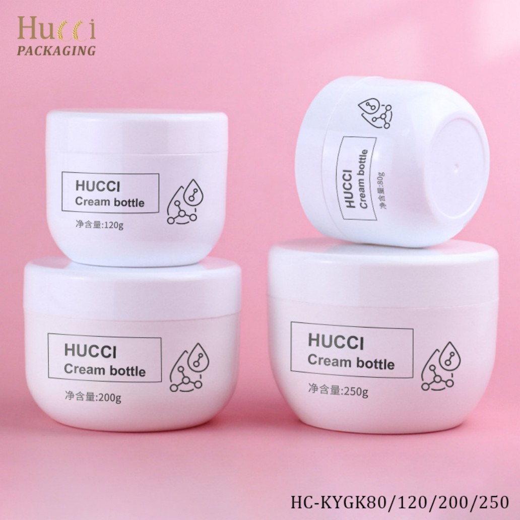 HUCCI White PP Cream Jars Stacked & Tilted Bottom View Pink Background