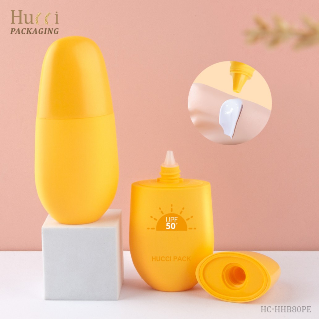 HUCCI Yellow PP Sunscreen Bottle with Detachable Cap on White Pedestal Pink Background