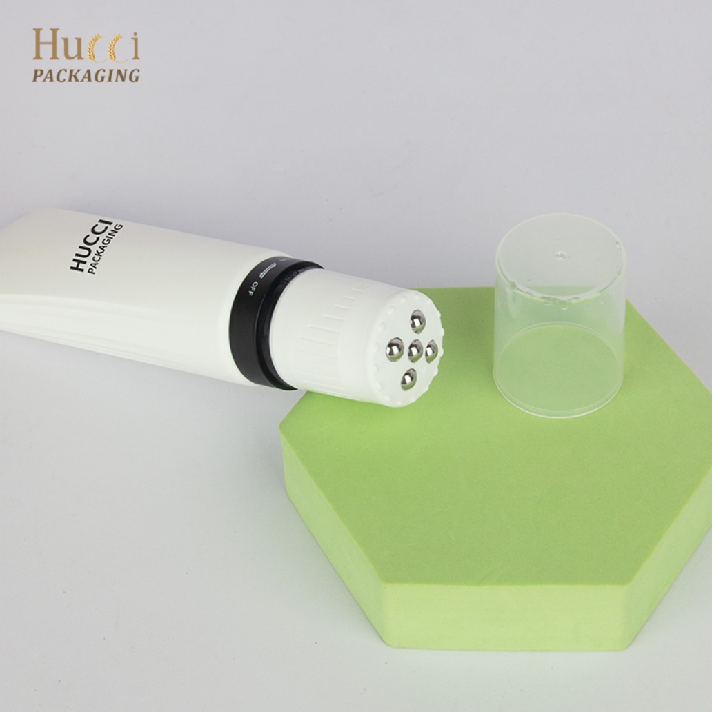 HUCCI 100ml PE Massage Tube with 5 Steel Balls Lying on Green Hexagon Stand with Detachable PP Cap}
