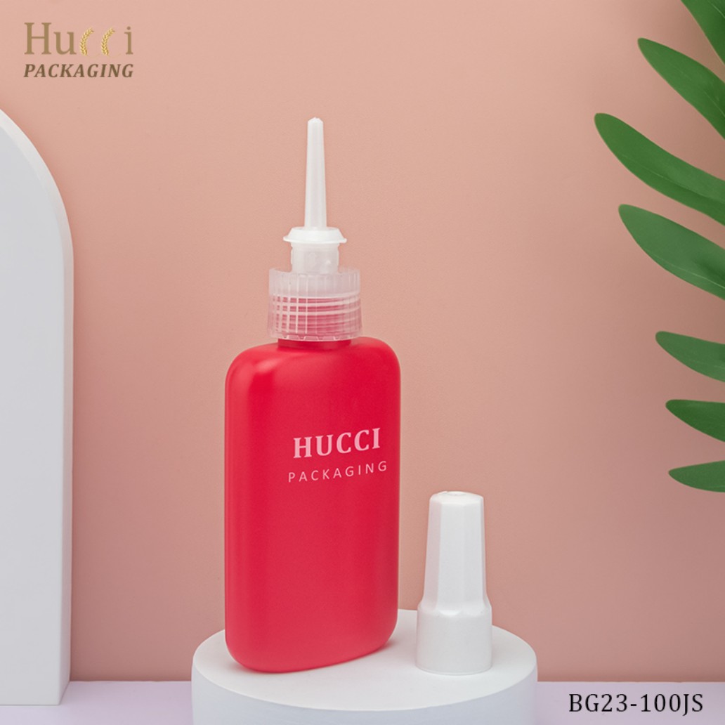 100ml Red LDPE Glue Bottle with Nozzle on Pink Background, Custom Printing Wholesale Packaging.}