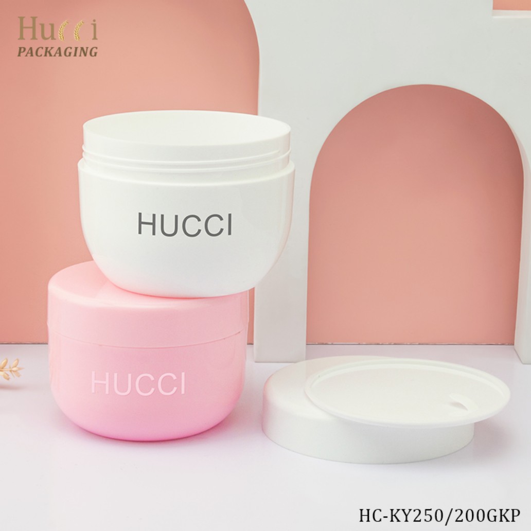 250ml White and 200ml Pink PP Cream Jars Stacked on Styled Background for Custom Cosmetic Packaging Wholesale.}