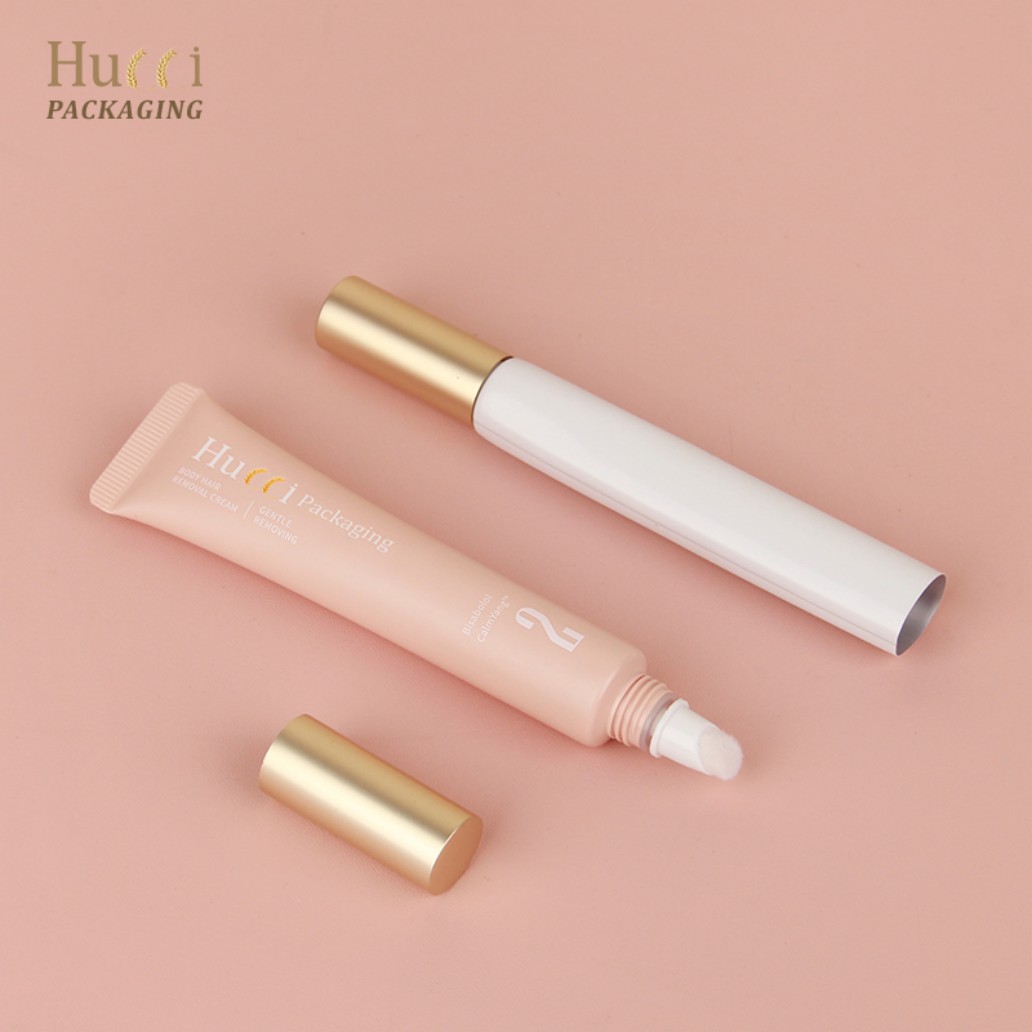 Pink and White PE Tubes Lying on Pink Background with Sponge Applicators, Customized Wholesale Packaging.}