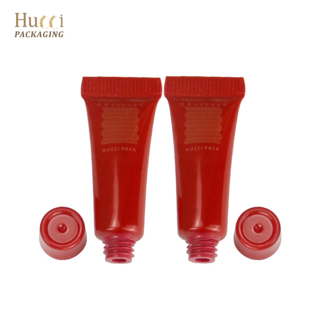 Empty Red PE Cosmetic Tubes with Detachable PP Caps, Customized Wholesale Packaging Supply.}