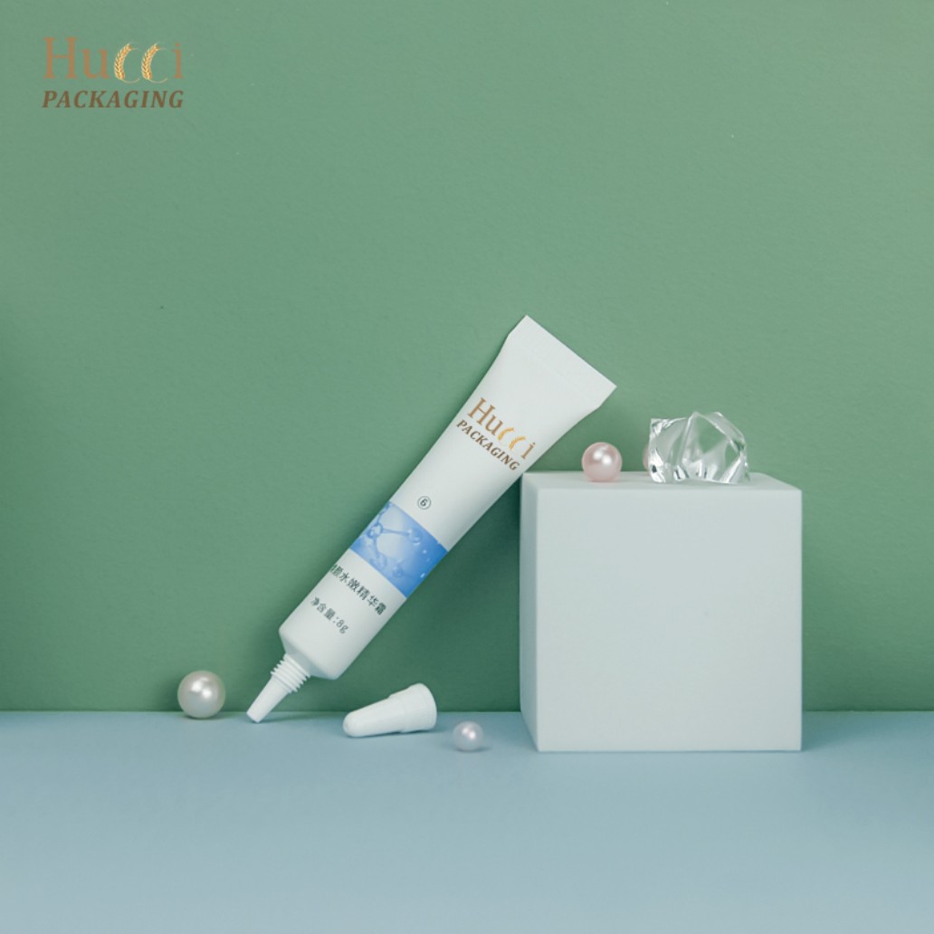 3-10ml White PE Serum Tube with Nozzle Cap on Green Background, Custom Logo Wholesale Packaging.}